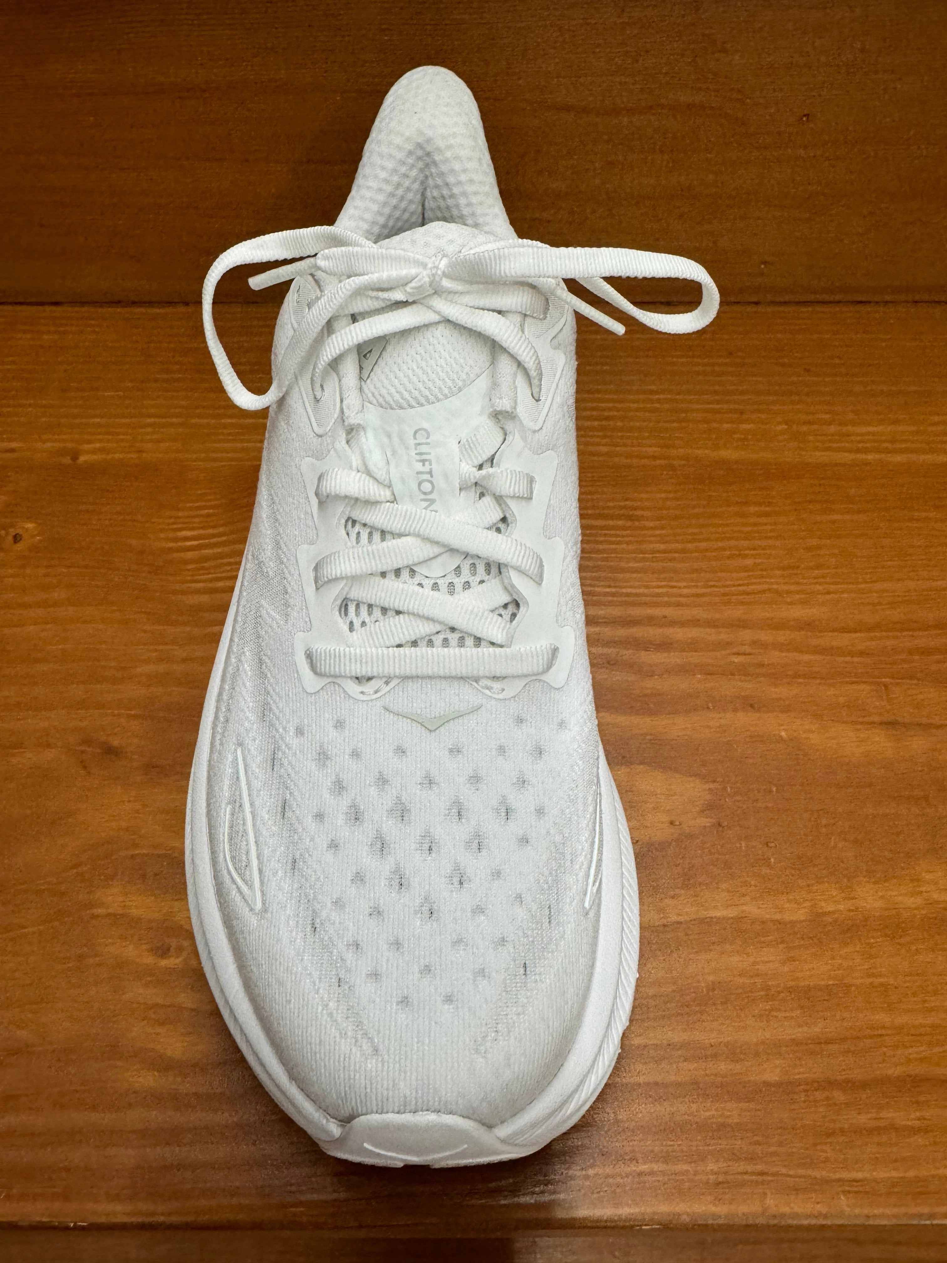 running in a meadow shoes Hoka Clifton 9 White/White 1127896 WWH