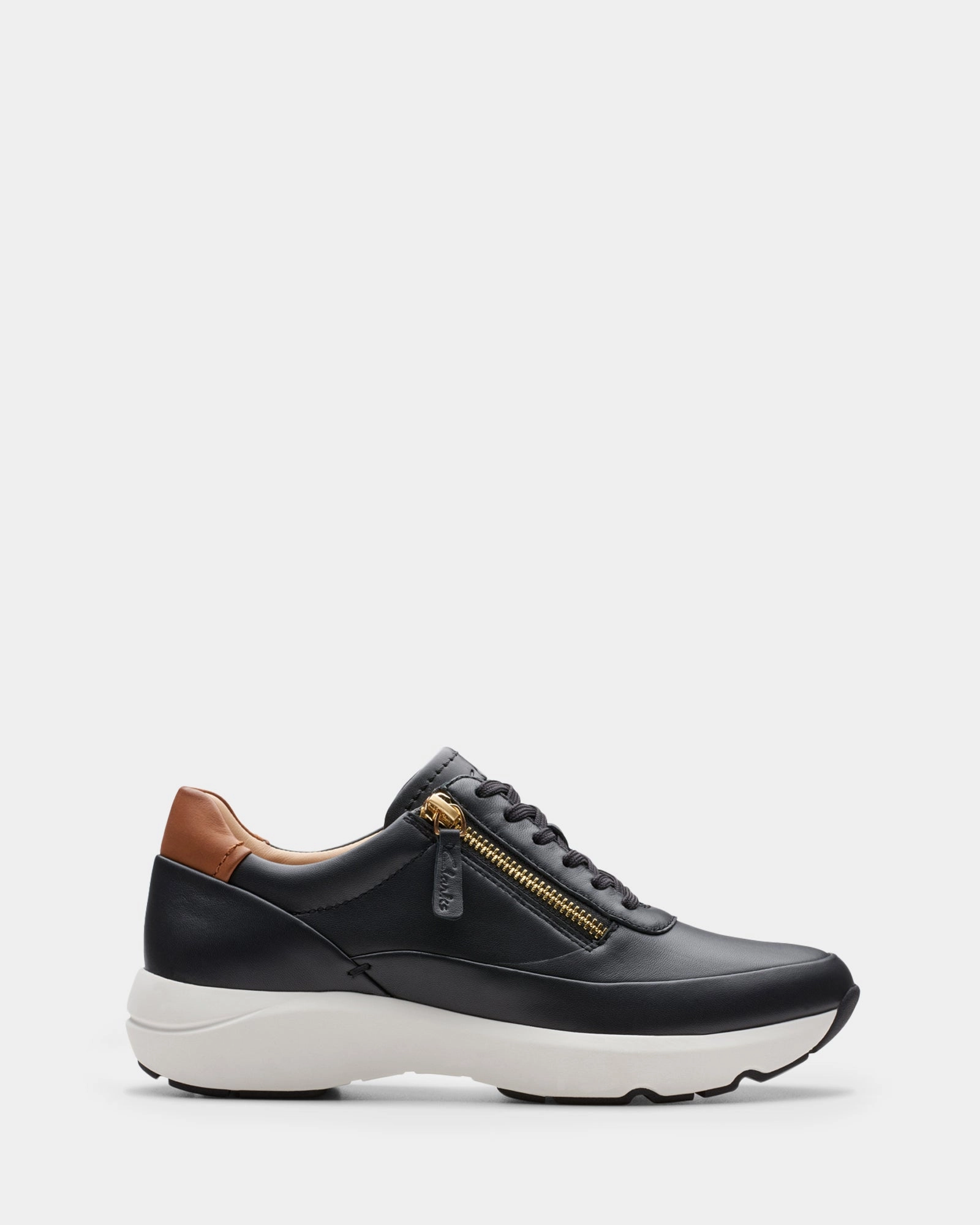 Tivoli Zip Black Leather running in a stone bridge area shoes