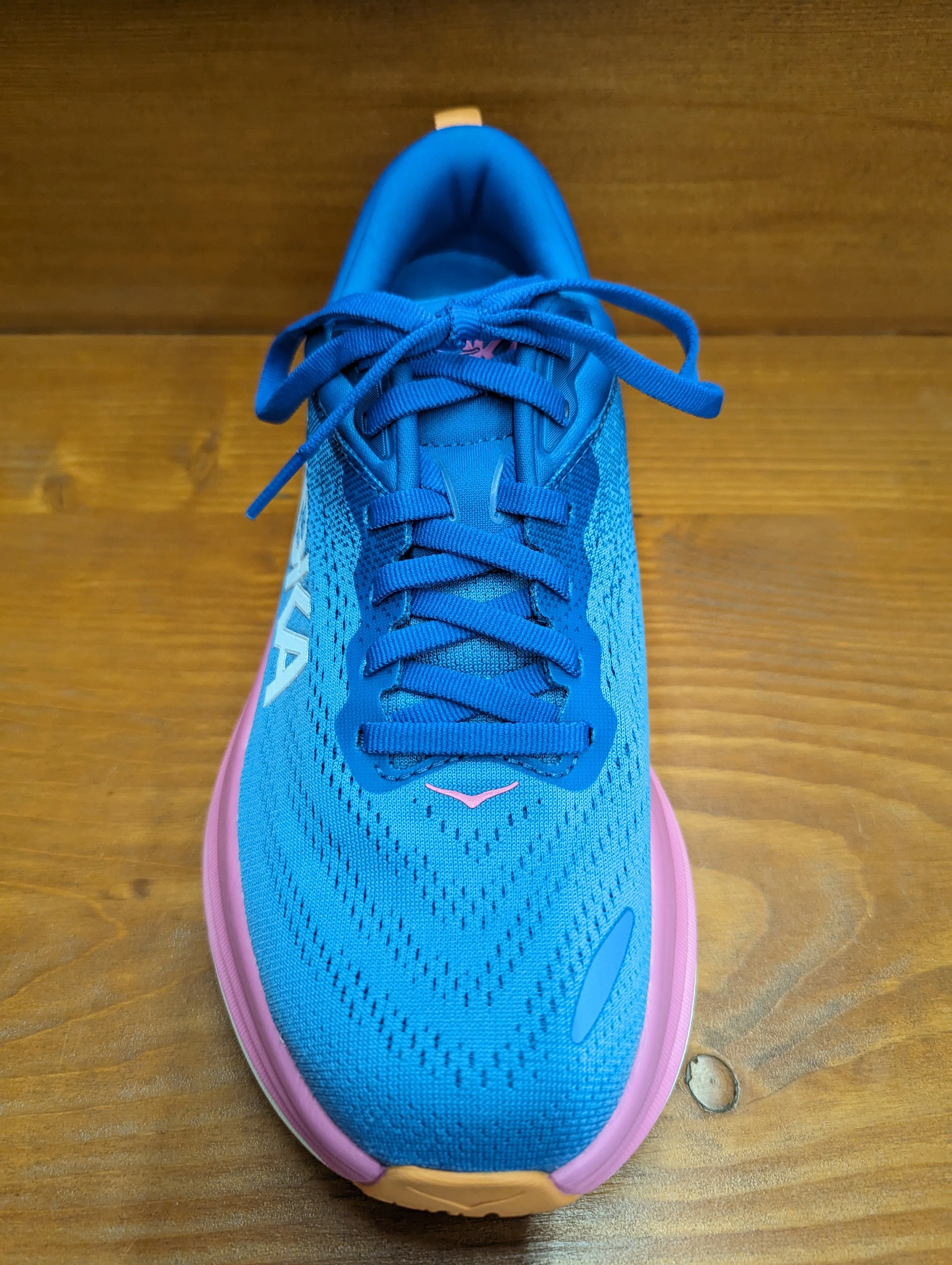 running in a tied - arch bridge area shoes long - distance - runner Hoka Bondi 8 Coastal Sky/All Aboard 1127952 CSAA & 1127954 CSAA